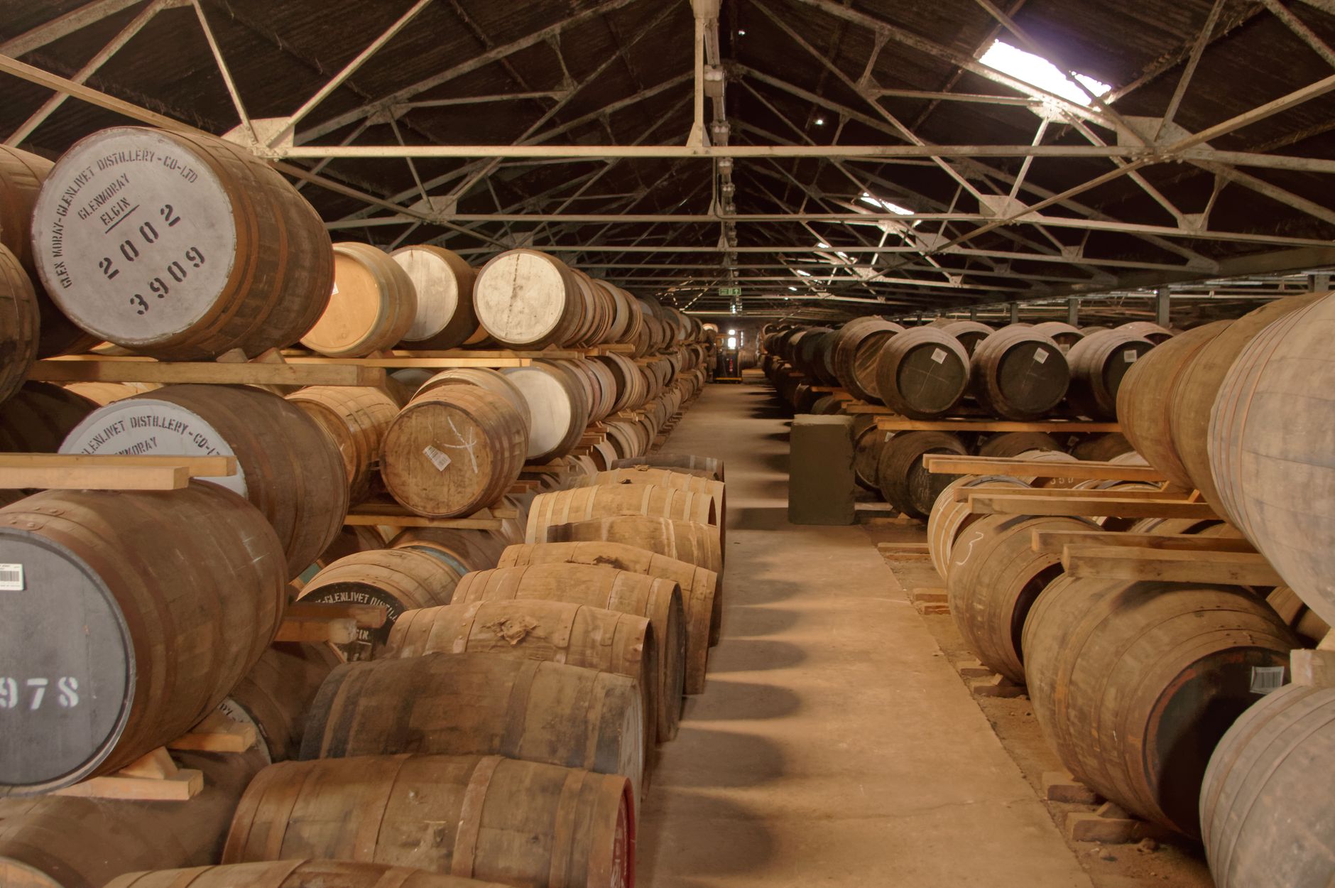 Oak casks in a dark warehouse